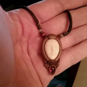 Artisan made bone face necklace